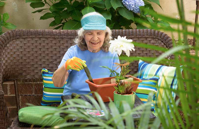 A caregiver and resident together in an Assisted Living apartment