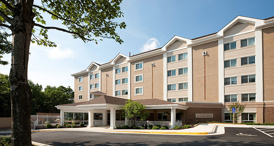 An exterior picture of the front of Tall Oaks.