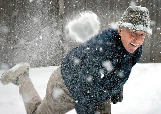 man throwing snowball