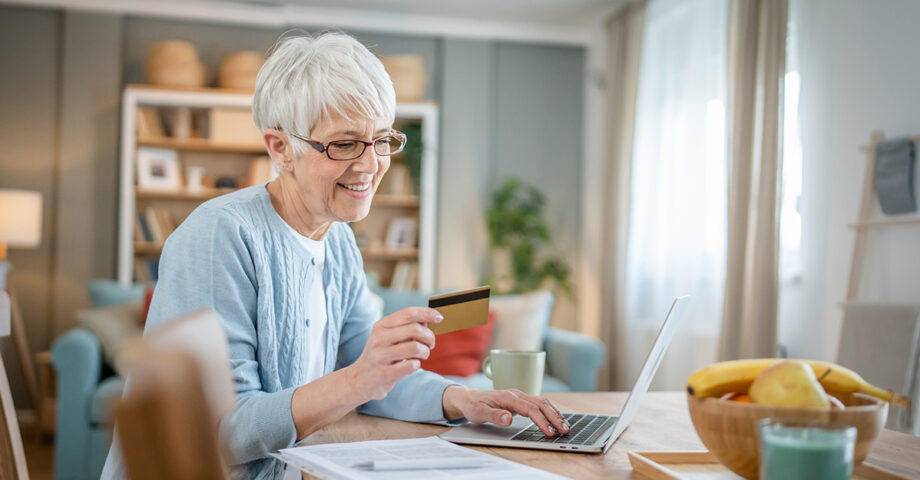 senior woman paying bills online