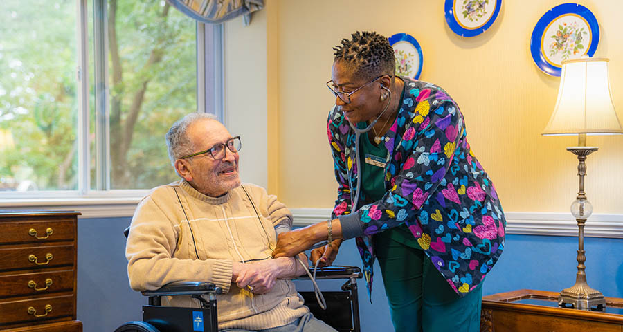 happy senior resident and Tall Oaks nurse